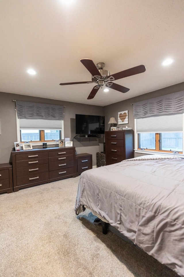 carpeted bedroom featuring ceiling fan