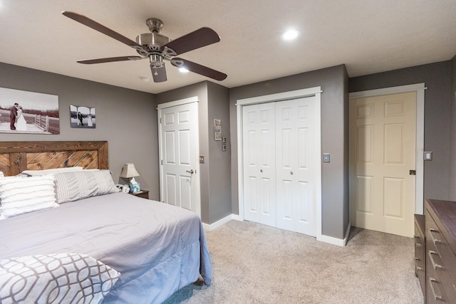 carpeted bedroom with ceiling fan