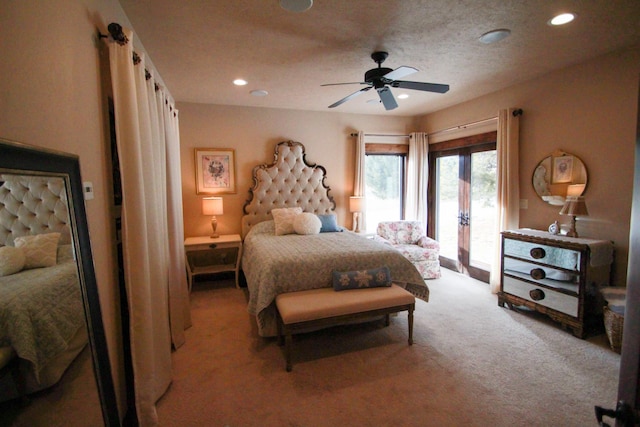 bedroom featuring access to exterior, ceiling fan, and light colored carpet