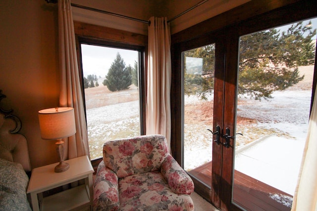 sunroom / solarium featuring french doors