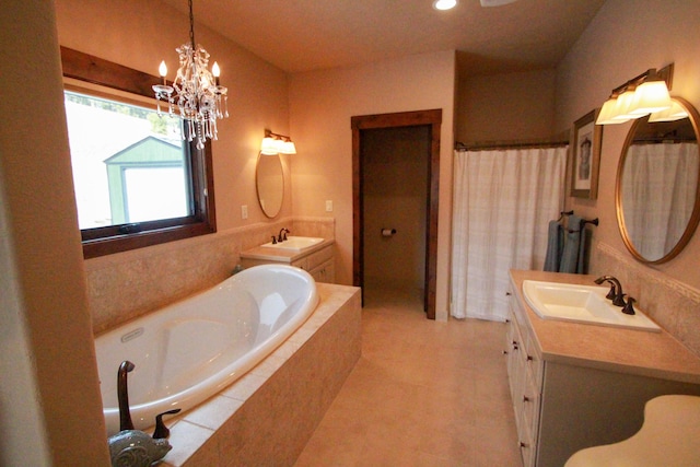 bathroom featuring a notable chandelier, independent shower and bath, tile patterned flooring, and vanity