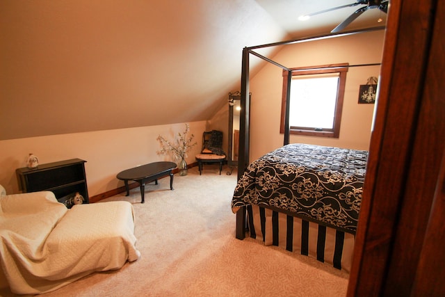 bedroom with lofted ceiling, ceiling fan, and carpet