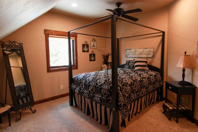 bedroom featuring lofted ceiling, light colored carpet, and ceiling fan