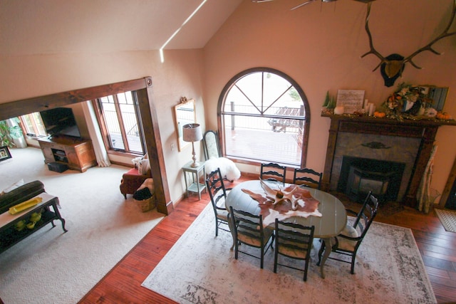 dining room with lofted ceiling, ceiling fan, and hardwood / wood-style floors