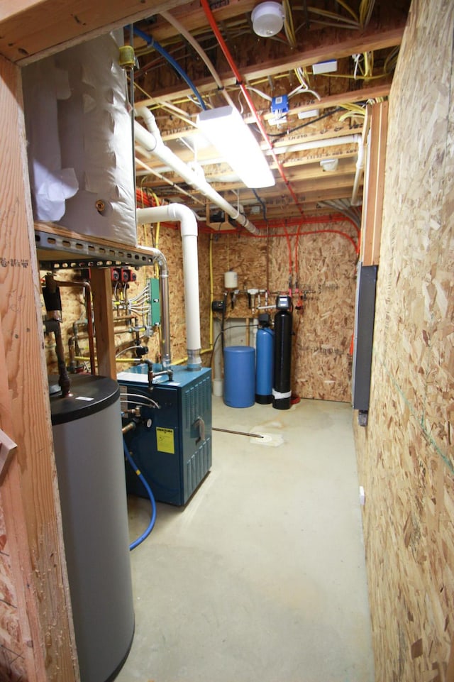 utility room featuring gas water heater