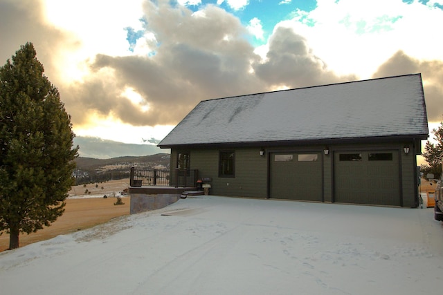 garage at dusk with a mountain view