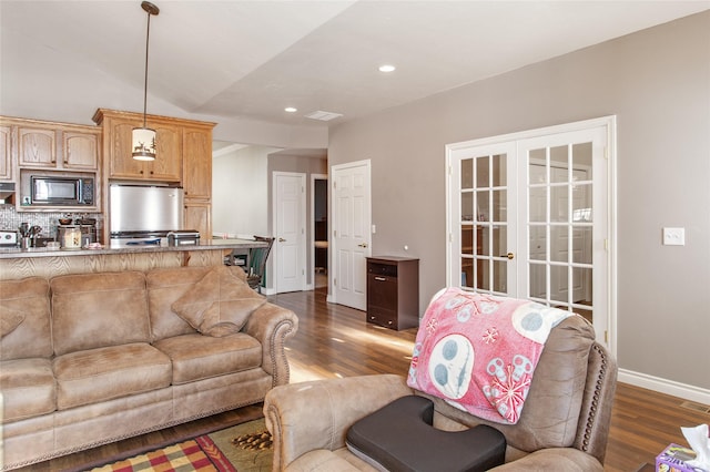 living room with french doors and dark hardwood / wood-style flooring