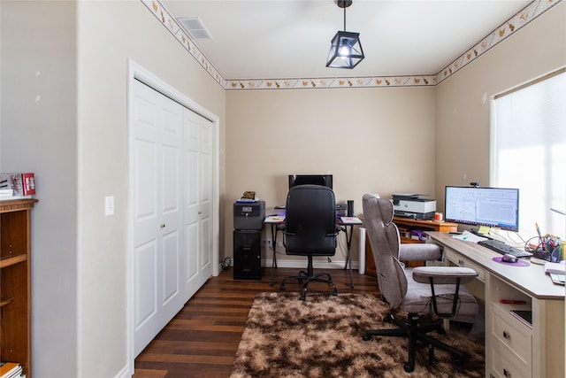 office space with dark hardwood / wood-style floors