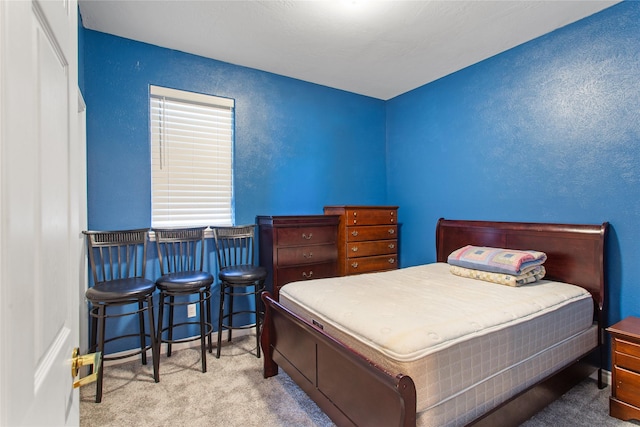 bedroom with light carpet