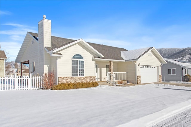 ranch-style house featuring a garage and a porch