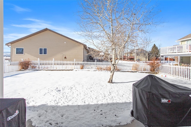 view of yard layered in snow