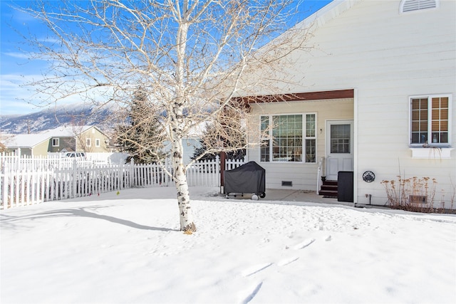 view of yard covered in snow