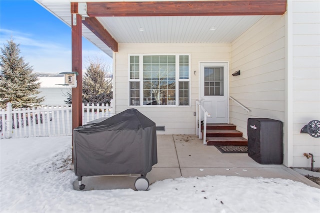 snow covered patio with grilling area