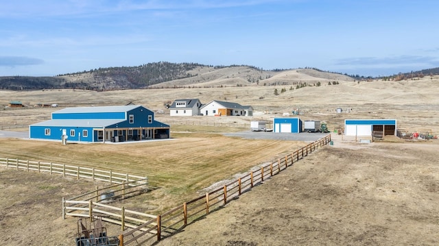 aerial view featuring a rural view and a mountain view