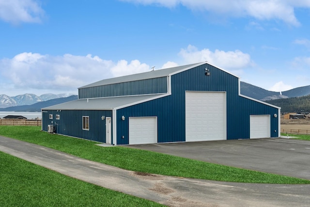 garage featuring central AC and a mountain view