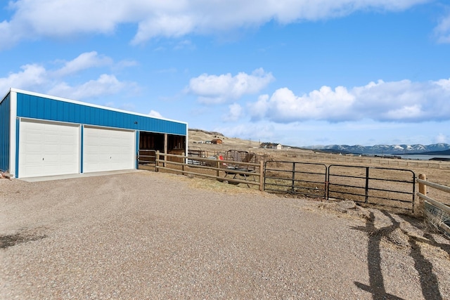 exterior space featuring a rural view and a mountain view