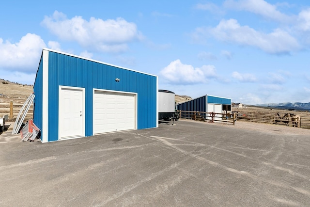 garage featuring a rural view