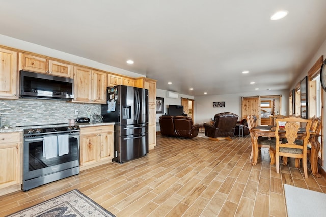 kitchen with stainless steel appliances, backsplash, and light brown cabinets