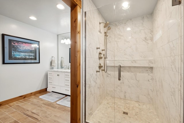 bathroom featuring an enclosed shower and vanity