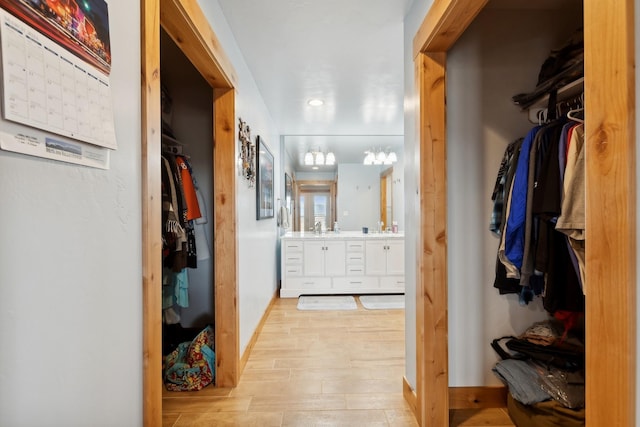 interior space with light hardwood / wood-style floors and sink