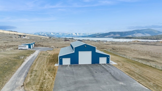 view of outbuilding with a garage and a mountain view