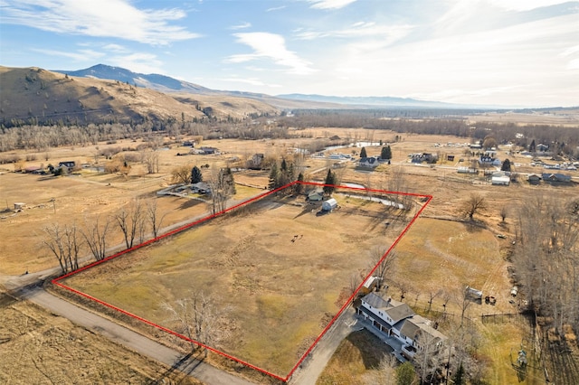 bird's eye view featuring a rural view and a mountain view