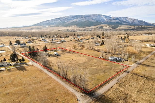 bird's eye view featuring a rural view and a mountain view