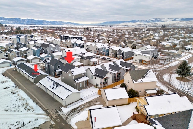 snowy aerial view with a mountain view