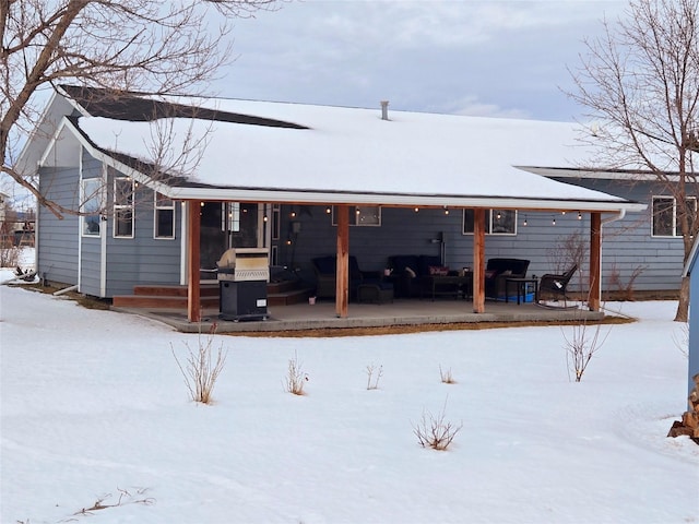 view of snow covered house