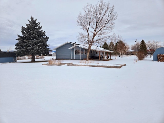 view of yard layered in snow