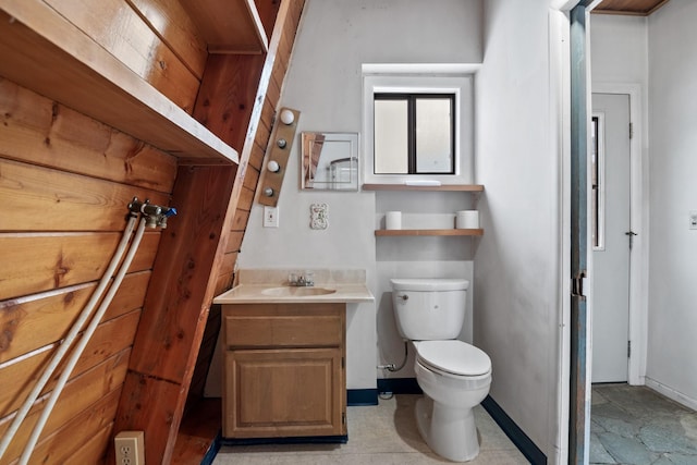 bathroom featuring toilet and vanity