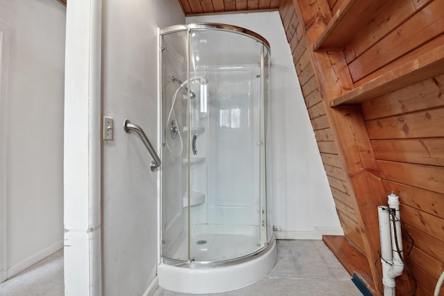 bathroom with an enclosed shower, wood walls, and wood ceiling