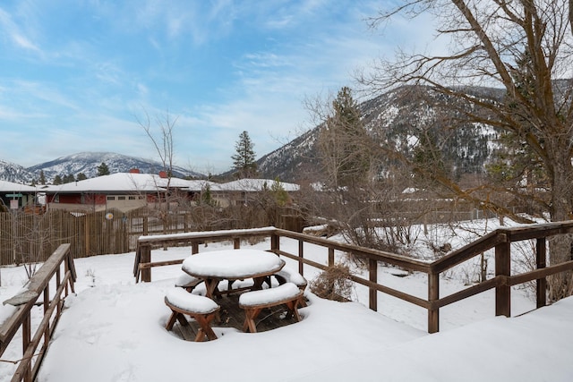 snowy yard featuring a mountain view