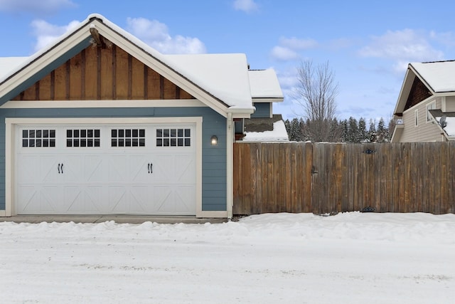 view of snow covered garage