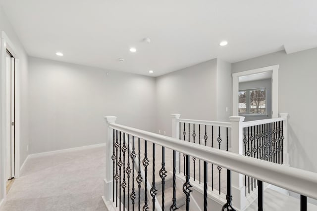 hallway featuring light carpet