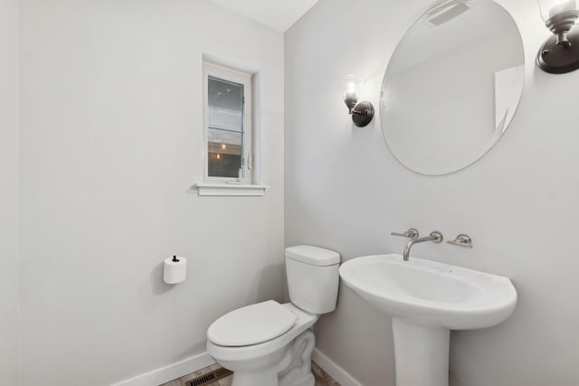 bathroom featuring toilet