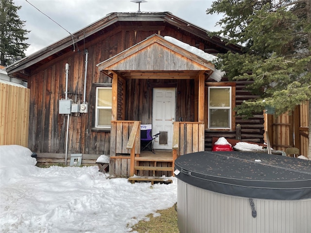 exterior space featuring a hot tub