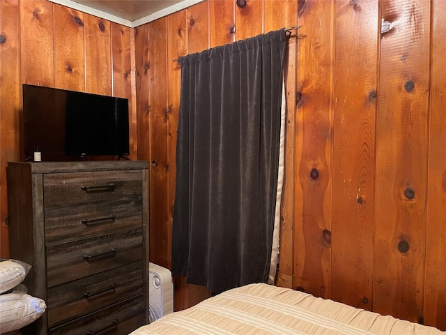 bedroom with wooden walls