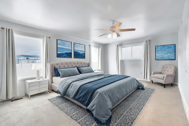 carpeted bedroom featuring ceiling fan