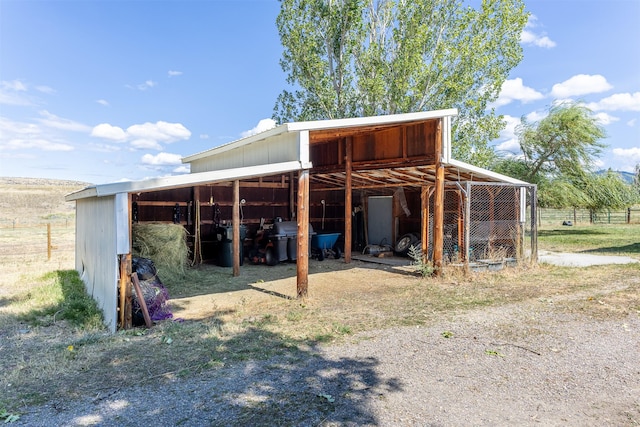 view of outdoor structure featuring a rural view