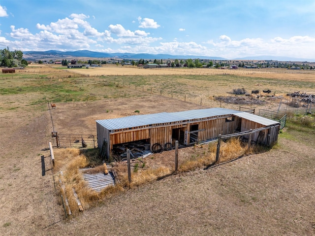 birds eye view of property featuring a rural view and a mountain view