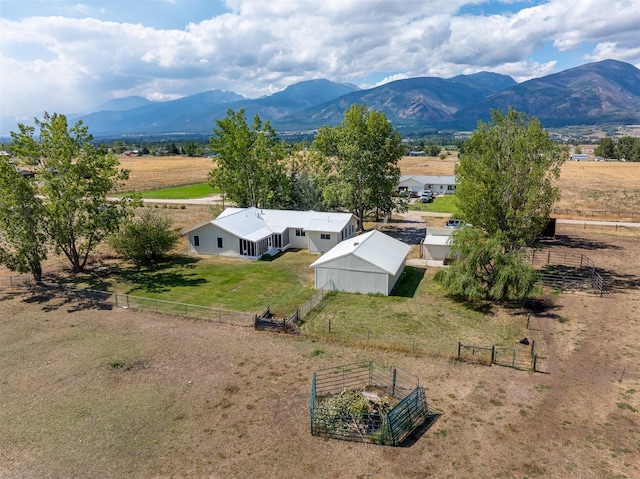 birds eye view of property with a rural view and a mountain view