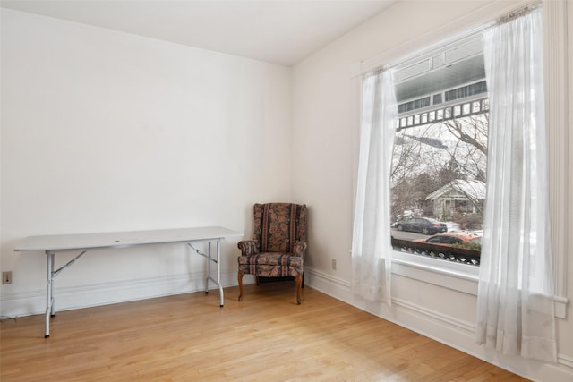 sitting room featuring light hardwood / wood-style floors