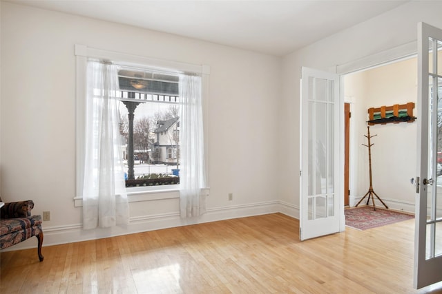 interior space featuring hardwood / wood-style flooring and french doors