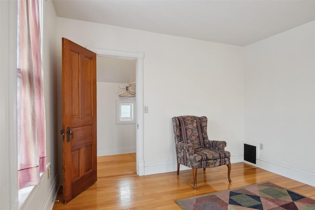 sitting room with light wood-type flooring