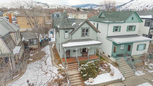 view of front of property featuring covered porch and a mountain view