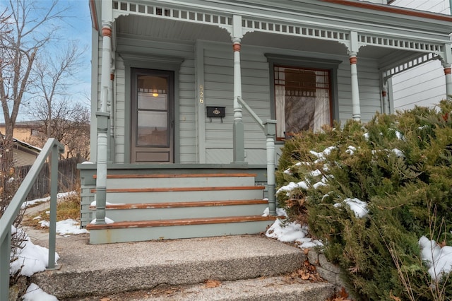 view of snow covered property entrance