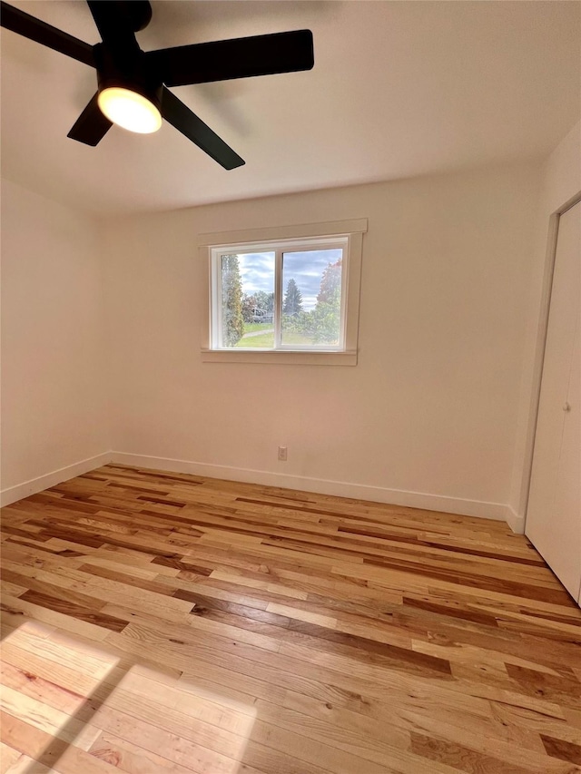 spare room with ceiling fan and light hardwood / wood-style floors