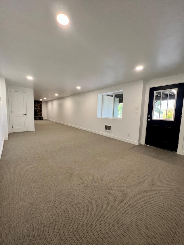 basement with light colored carpet