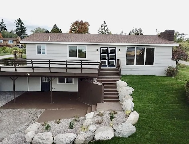 rear view of house with a yard